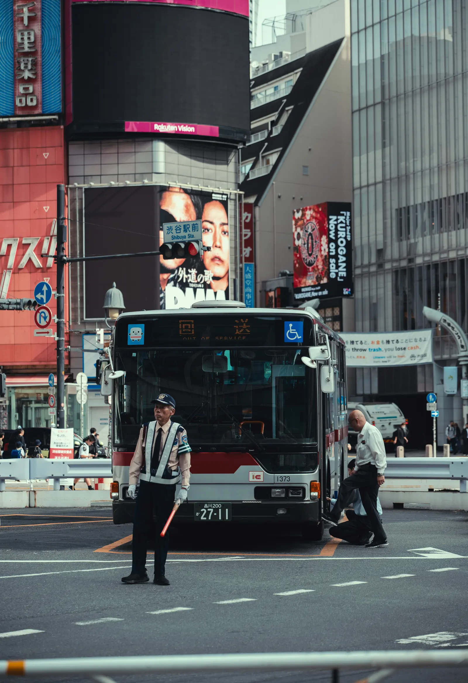 An urban street scene with passing traffic