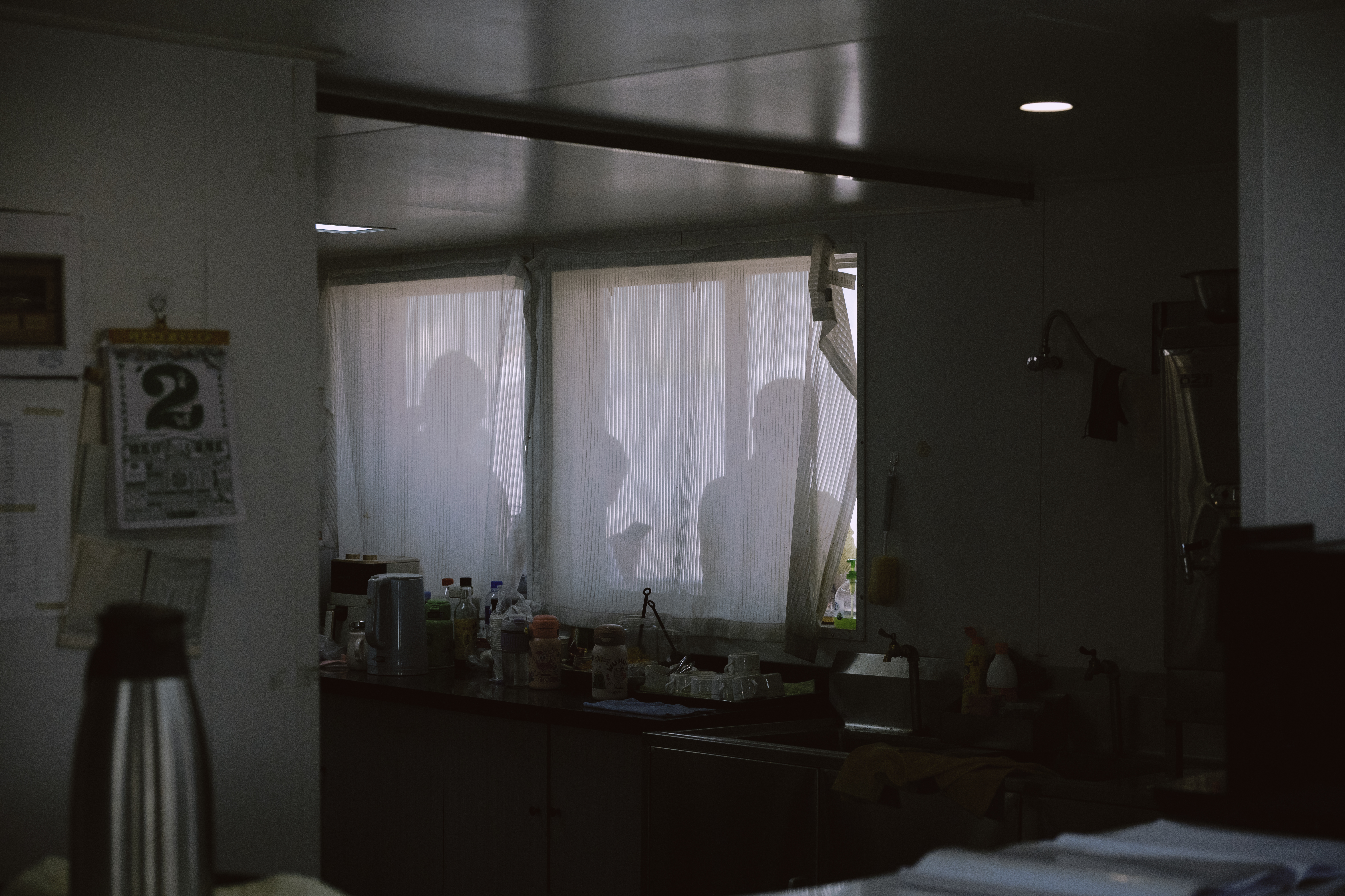 A quiet room lit through large windows